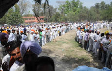 Farmers await their turn in long queues at stalls selling seeds at the Kisan Mela held at the PAU Regional Research Station in Bathinda on Thursday.