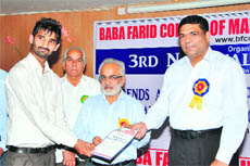 Managing director of Baba Farid Group of Institutions, Gurmeet Singh Dhaliwal (centre), presents memento to the participants at the two-day conference on brand management in Bathinda on Thursday. 