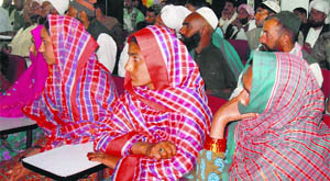Van Gujjar women participate in a meeting held at RLEK in Dehradun on Thursday.
