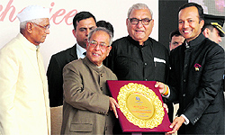 President Pranab Mukherjee is presented a memento by Vice Chancellor, Naveen Jindal as Chief Minister Bhupinder Singh Hooda (centre) and Governor Jagannath Pahadia (left) look on at the inauguration of a conference on the Future of Indian universities: comparative perspectives on higher education reforms for a knowledge society at OP Jindal Global University at Jagdishpur village (Sonepat) on Thursday