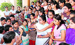Chaudhary Devi Lal University Registrar Manoj Siwach (left) trying to pacify students protesting against the lackadaisical attitude of wardens after a girl was injured in Kalpana Chawla hostel of the university at Sirsa on Thursday