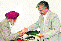 Dr PS Ahuja, Director, IHBT, Palampur, and Prof Farqan Qamar, Vice-Chancellor, Central University of Himachal Pradesh, exchange copies of MoU at CUHP, Shahpur, on Thursday