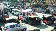 An ambulance gets struck in a traffic jam outside the Civil Hospital on the Old GT Road in Jalandhar