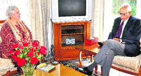 Governor NN Vohra with honorary general secretary of the IRCS, J&K branch, Roma Wani at Raj Bhawan in Jammu on Thursday