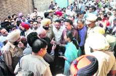 The protesters argue with the MC officials at Talab Bazaar in Ludhiana on Thursday. 