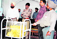 Officials of the district administration conduct the draw of lots for the allocation of liquor vends
