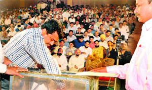 An applicant takes part in a draw of lots at the Bassi Theatre, Phase II, in Mohali on Friday.