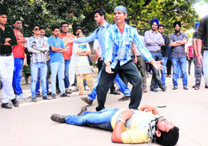 Students of Alankar Theatre enact a play on Shaheed Bhagat Singh at the Student Centre of Panjab University in Chandigarh on Friday. 
