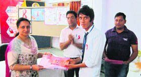 An AIDS educator being felicitated at the educators camp held at the Dolphin (PG) Institute in Dehradun.