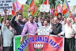 BJP activists hold a protest against the coalition government in Jammu on Friday. 
