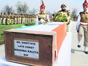 BSF IG PS Sandhu pays tributes to slain BSF jawan Krishna Kalita, killed in a militant attack on Thursday, during a wreath-laying ceremony on the outskirts of Srinagar on Friday. 
