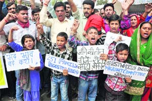 Activists of erstwhile Doda Migrants Committee stage a protest in support of their demands in Jammu on Friday.