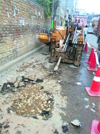 The machine that damaged an underground water supply line in the Dhand Road area, Ludhiana, on Friday.