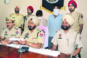 Mohinder Kumar and his accomplice Sonu in the police custody in Ludhiana on Friday.