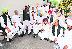 Congress legislators pass a resolution at a mock assembly session outside the Vidhan Sabha complex in Chandigarh on Friday