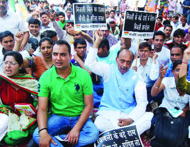 President of the Delhi unit of the BJP Vijay Goel with party activists shout slogans during a protest against the hike in power tariff outside the Chief Ministers residence in New Delhi on Saturday.