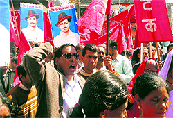 Members of AITUC raise slogans in remembrance of Shaheed Bhagat Singh in Mussorie on Saturday