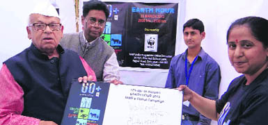 Governor Aziz Qureshi with his Earth Hour 2013 pledge at Raj Bhavan in Dehradun on Saturday.