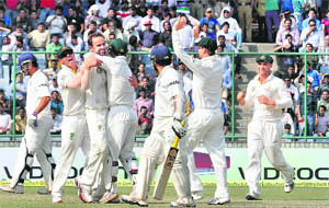 The Australian team is all charged up after the dismissal of Sachin Tendulkar (32).