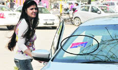 A challan sticker pasted on a car outside the Park Plaza hotel.