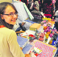 Eva Riedesperger from Austria exhibits products made by mentally challenged children of Nirdosh School at a carnival in Ludhiana. 