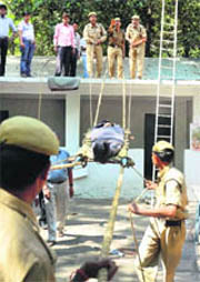 Madhya Pradesh police home guards and civil defence personnel show their rescue skills during a drill in Bhopal on Saturday.
