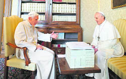 Pope Francis (R) and Pope Emeritus Benedict XVI during a private meeting at the Castel Gandolfo summer residence, south of Rome, on Saturday.