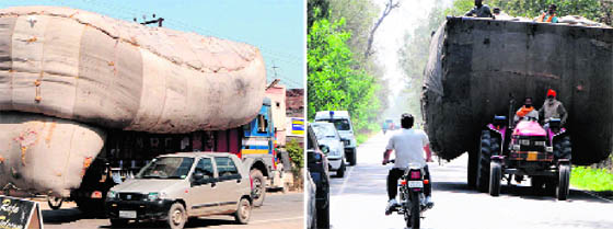 An overloaded truck and trolley plies on the GT Road in Amritsar on Sunday.