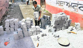 Interlocking tiles being laid in the Parasram Nagar area on Sunday.