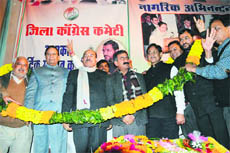 PCC president Sukhvinder Singh (centre) with Health Minister Kaul Singh Thakur, Animal Husbandry and Rural Development Minister Anil Sharma and Excise and Taxation Minister Parkash Chaudhary at a party function in Mandi on Sunday. 