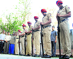 Jawans of the Punjab Police reverse their arms in honour of late TR Suri in Jalandhar on Sunday