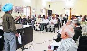 A pensioner speaks during a meeting of the Northern Railway Pensioners Welfare Association at the NRMU Complex in Ludhiana on Sunday