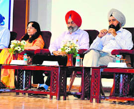 VC, Central University of Punjab, Dr Jai Rup Singh (centre), shares the stage with GNDU vice-chancellor Prof Narinder Kumar Mehra (R) in Amritsar on Monday. 