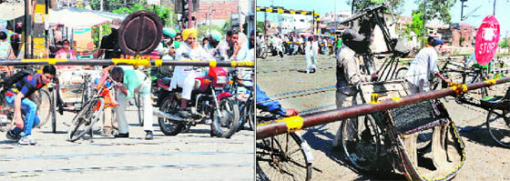 In the absence of a flyover, people make their way across the railway crossing near Shivala road in Amritsar, with the gate closed, unmindful of the danger.