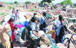 Children leave for school at the demolished Azad Colony in Sector 21, Panchkula, on Monday.