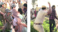 Police personnel use lathis on residents at Azad Colony.