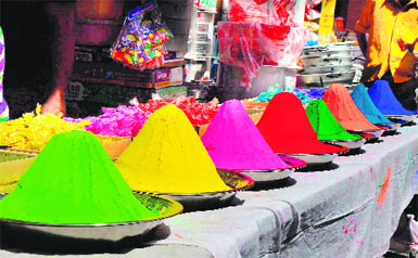 Colours on sale for the Holi festival at a shop in Haridwar on Monday.