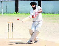 A batsman plays a shot during a match in the 61st Dehradun District Cricket League 