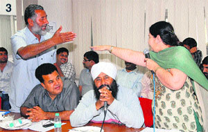 councillors argue with Deputy Mayor Arvinder Kaur during the Jalandhar MC Budget meeting in Jalandhar on Monday.