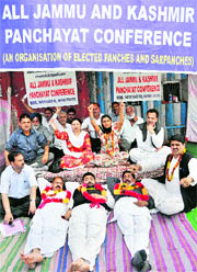 Members of All Jammu and Kashmir Panchayat Conference protest in Jammu on Monday.