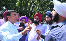 The Civil Surgeon, Dr Subhash Batta, tries to convince protesting chemists in Ludhiana on Monday. 