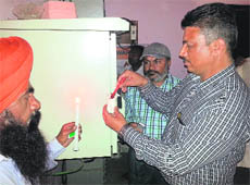 MC officials seal a mobile phone tower in the Vishal Nagar area in Ludhiana on Monday. 