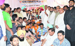 CLP leader Sunil Jakhar addresses Congress workers protesting against property tax in Ludhiana on Monday. 