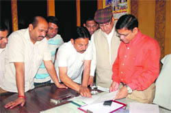 Members of temple committees and shopkeepers meet MC Commissioner Rakesh Kumar Verma (extreme right) at his Zone-A office in Ludhiana on Monday.