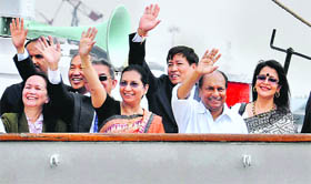 Defence Minister AK Antony with wife Elizabeth (3rdR) at the return of training ship INS Sudarshini after a six-month voyage to South East Asia, in Kochi on Monday.