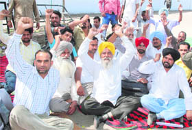 PRTC workers stage protest in Bathinda on Tuesday demanding acceptance of their demands by the state government.