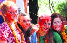 Foreigners celebrate Holi at Nanhi Dunya School in Dehradun on Tuesday