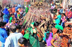 People worshipping Holika at Khankhal, Haridwar, on Tuesday
