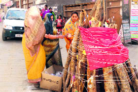 Women begin making preparations for the festival of Holi in Mussoorie on Tuesday.