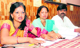 Rekha Negi of Anganwari Workers Association address a press conference in Dehradun on Tuesday.